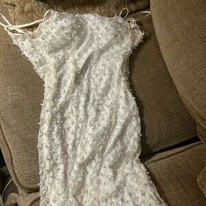 A white glitter sliver dress with stones